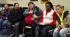 Keolise visits with Kristal, another guest, Lori, Shivers, the service dog,and Norma.