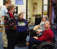 Mike Kennedy and Tammy Laverty, MWCIL Board members, talk to Jini and Edwina.