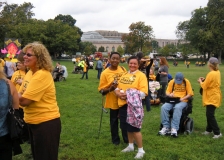 Photo of two women, and the crowd.