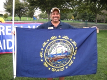 Dave from MWCIL is holding New Hampshire state flag.