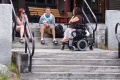 Filomena talking on stairs