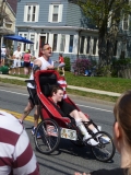 Man pushing boy in chair