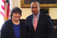 Rose Quinn, Assistant Director at MetroWest Center for Independent Living, poses with Governor Deval Patrick.