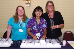 Registration Table with Alice, Audrey and Chris