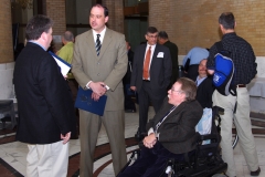 Steve Higgins, Executive Director of IACIL, James Eldridge, State Senator, and Paul Spooner, Executive Director of MWCIL