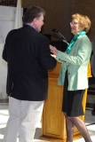 Steven Higgins, Executive Director of IACIL, greets Representative Ellen Story.