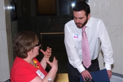 Cathy, an MWCIL consumer, talks to Bob, a staff person with Representative Steven Levy.