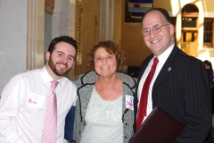 Debbie, a consumer at MWCIL, speaks with State Rep. Steven Levy (right) and his staff person, Bob.