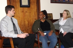 Carol (center), an MWCIL consumer, and Tina (right), an MWCIL Peer Counselor, speak with a staff person at Representative Tom Sannicandro's office.