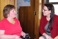 Cathy, a consumer at MWCIL, speaks Catherine, staff for State Senator Richard Ross.