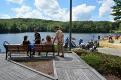 view of bench and pond