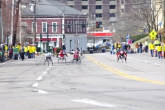 Four wheelchair racers coming up the hill in Wellesley