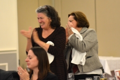 Jean McGuire of Northeastern and Rosalie Edes of the Office of Disability Policy and Programs applaud Bill and Liz