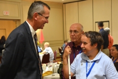 John Polanowicz, Secretary of EOHHS talks to attendee from STAVROS