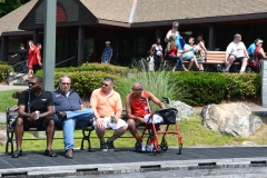 4 men on a bench