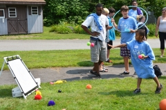 boy playing with pitchback