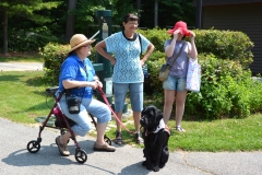 3 women and a service dog relax