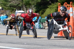 three wheelchair racers