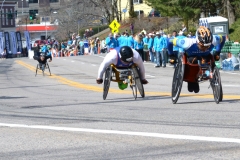 three wheelchair racers