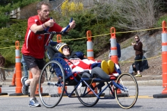 Man pushing wheelchair