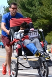 Michael Porter of Virginia pushing wheelchair