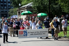 marchers with banner - 25 years of the americans with disabilities act