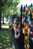 paper chain of disability messages on fence