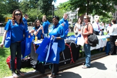 women giving out ADA 25 bags