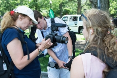 Tyler helps woman with her camera