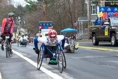 pack of wheelchair and handcycle racers