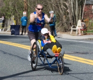 man pushing a wheelchair