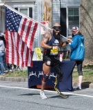 Jose Sanchez, Texas - one leg, carring large american flag