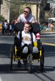man pushing young man in wheelchair