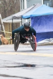 Front photo of man racing in wheelchair