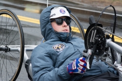 photo of determined looking reclining handcycle racer