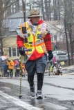 Early start man - probably named Carlos, walking with a pole/cane and brightly dressed.