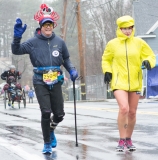 mobility impaired walker - with a pole/cane, and a lobster on his head, and a huge smile. A racer who warms up the crowd.