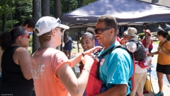 Man's life jacket is adjusted