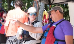 people in life jackets talking