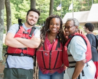 Three people ready to kayak