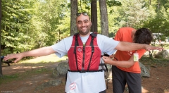 Man gets his life jacket adjusted