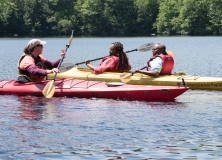 Three kayakers