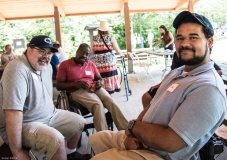 Three people in pavilion