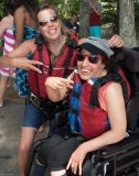Young woman and another woman getting ready to kayak
