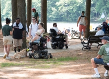 View of people in the shade and the pond