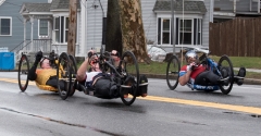 3 handcyclists with no visible numbers