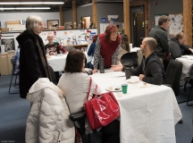 several people socializing at tables