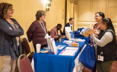 Attendees look at exhibits