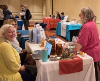 Attendees look at exhibits