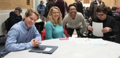 4 young people at table